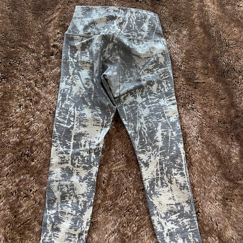 Gray legging with shining silver detail. Worn a handful of times.